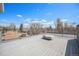 Enjoy city views from this rooftop deck with gray decking and black metal railings at 4225 W 30Th Ave, Denver, CO 80212