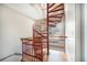 Unique spiral staircase featuring red railing and wood treads; flooded with natural light at 4225 W 30Th Ave, Denver, CO 80212