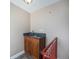 Stylish wet bar area boasts a dark granite countertop and custom wood cabinetry at 4225 W 30Th Ave, Denver, CO 80212