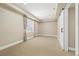 Spacious basement with carpet flooring, neutral walls, and a barn-style door at 4193 W 99Th Ct, Westminster, CO 80031
