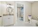 Bright bathroom featuring a granite vanity, modern fixtures, and a connecting doorway to the bath and shower at 4193 W 99Th Ct, Westminster, CO 80031