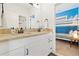 Upgraded bathroom with double sinks, granite counters, modern fixtures, and a doorway to an adjacent bedroom at 4193 W 99Th Ct, Westminster, CO 80031