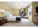 Bright bedroom featuring a decorative chandelier, sitting area, and neutral color scheme at 4193 W 99Th Ct, Westminster, CO 80031