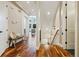 Inviting entryway with hardwood floors, a bench, and staircase leading to the upper level at 4193 W 99Th Ct, Westminster, CO 80031