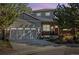 Charming two-story home featuring a gray exterior, attached garage, and well-manicured landscaping at 4193 W 99Th Ct, Westminster, CO 80031