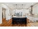 Modern kitchen boasts stainless steel appliances, granite countertops, a central island, and custom cabinetry at 4193 W 99Th Ct, Westminster, CO 80031