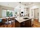 Open kitchen flows into living area, featuring stainless appliances, a large island, and modern design at 4193 W 99Th Ct, Westminster, CO 80031