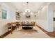 Inviting living room showcasing tray ceilings, stylish furniture, and sophisticated decor at 4193 W 99Th Ct, Westminster, CO 80031