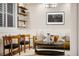 Comfortable living area featuring modern furniture, open shelving, and stylish decorative accents at 4193 W 99Th Ct, Westminster, CO 80031