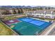 Aerial view of community showcasing outdoor sports court and beautiful scenery, with trees and buildings at 5316 S Jellison St, Littleton, CO 80123