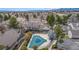 Aerial view of community with pool and surrounding townhomes, offering a glimpse into the neighborhood layout at 5316 S Jellison St, Littleton, CO 80123