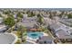 Aerial view of a community with pool and surrounding townhomes, showcasing mature trees and well-maintained grounds at 5316 S Jellison St, Littleton, CO 80123