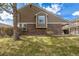 Exterior view of the home showcasing the siding and landscaping at 5316 S Jellison St, Littleton, CO 80123