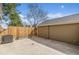 Private backyard featuring fenced-in area, AC unit, and mature trees, ideal for relaxation at 5316 S Jellison St, Littleton, CO 80123
