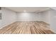 Basement featuring hardwood flooring, neutral walls, and recessed lighting, providing a clean and open space at 5316 S Jellison St, Littleton, CO 80123