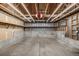 Unfinished basement with concrete flooring and walls, exposed ceiling with open ductwork and lighting at 5316 S Jellison St, Littleton, CO 80123