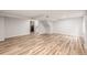 Finished basement area featuring wood flooring, stairs, and recessed lighting, ready for customization at 5316 S Jellison St, Littleton, CO 80123