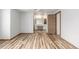 Bedroom showcasing wood-look flooring and an ensuite bathroom with a vanity at 5316 S Jellison St, Littleton, CO 80123