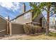 Home exterior showcasing the siding, landscaping, trees, chimney and a partial view of the front yard at 5316 S Jellison St, Littleton, CO 80123