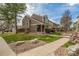 Inviting townhome with a well-manicured lawn and a cozy, covered porch at 5316 S Jellison St, Littleton, CO 80123