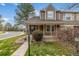A charming townhome with a landscaped front yard, sidewalk, and covered porch at 5316 S Jellison St, Littleton, CO 80123