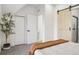 Bright bedroom with a barn door, cozy carpet, and a walk-in closet at 512 W 8Th Ave, Denver, CO 80204