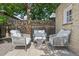 Relaxing patio furniture under shade tree at 1260 Adams St, Denver, CO 80206