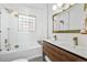 Bathroom with double vanity, walk-in shower, and gold fixtures at 1260 Adams St, Denver, CO 80206