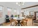 Bright dining area with round table and mid-century modern chairs at 1260 Adams St, Denver, CO 80206