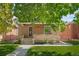 Quaint brick home with tree-lined street at 1260 Adams St, Denver, CO 80206