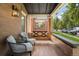 Relaxing front porch featuring a swing and comfortable seating at 1260 Adams St, Denver, CO 80206