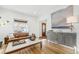 Living room with hardwood floors, large artwork and statement cabinet at 1260 Adams St, Denver, CO 80206