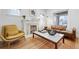 Light-filled living room features hardwood floors and a marble coffee table at 1260 Adams St, Denver, CO 80206