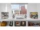 White shelving displays vinyl records, Gathering photos, and decorative items at 1260 Adams St, Denver, CO 80206