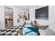 Sunroom with checkerboard floor, guitar display, and view into kitchen at 1260 Adams St, Denver, CO 80206