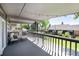 Covered back deck featuring comfortable seating and string lights, ideal for relaxing outdoors at 4545 S Lipan Ct, Englewood, CO 80110