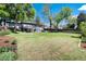 Large, well-maintained backyard with a deck, patio, and a privacy fence at 4545 S Lipan Ct, Englewood, CO 80110