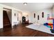 Finished basement offering flexible space for recreation and play with hardwood-style floors at 4545 S Lipan Ct, Englewood, CO 80110