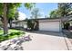 Charming single-story home with a well-manicured lawn and a two car garage at 4545 S Lipan Ct, Englewood, CO 80110