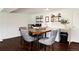 Well-appointed kitchen with a stylish seating, modern appliances, ample counter space, and sleek white cabinetry at 4545 S Lipan Ct, Englewood, CO 80110