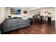 Spacious living room featuring modern furnishings, fireplace, wood floors, and open concept kitchen area at 4545 S Lipan Ct, Englewood, CO 80110