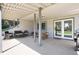 Covered patio with seating area and dining table, perfect for outdoor entertaining at 4545 S Lipan Ct, Englewood, CO 80110