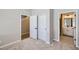 Carpeted bedroom with closet and adjacent bathroom at 8321 Mount Kataka St, Littleton, CO 80125