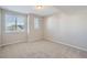 Cozy bedroom with large windows offering great natural light and plush carpeting at 8321 Mount Kataka St, Littleton, CO 80125