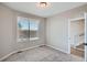 Bedroom featuring natural light, neutral walls, carpet, and a view from the window at 8321 Mount Kataka St, Littleton, CO 80125