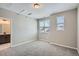 Bright bedroom with large window, light-colored walls, and plush carpeting at 8321 Mount Kataka St, Littleton, CO 80125