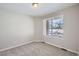 Bright bedroom with plush carpet, natural light, and neutral color palette at 8321 Mount Kataka St, Littleton, CO 80125