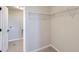 Walk-in closet featuring wire shelving and convenient access to the adjacent laundry room at 8321 Mount Kataka St, Littleton, CO 80125