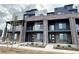 Modern townhome with brick facade, balconies, and contemporary design at 8321 Mount Kataka St, Littleton, CO 80125