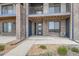 Modern townhome exterior with a covered porch and well-maintained landscaping, offering curb appeal at 8321 Mount Kataka St, Littleton, CO 80125